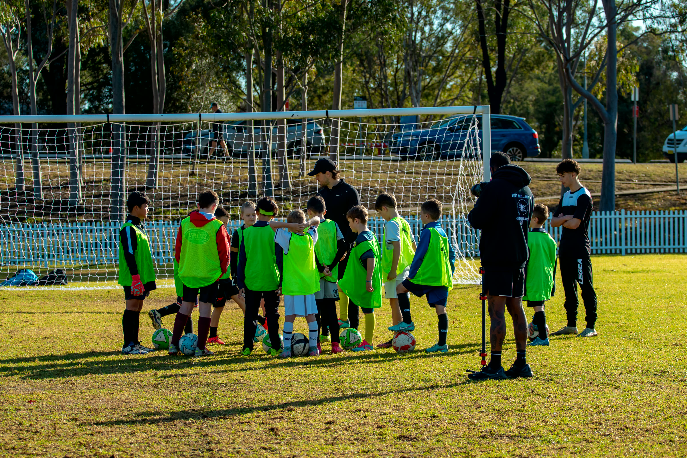 A group of camp players in training bibs.