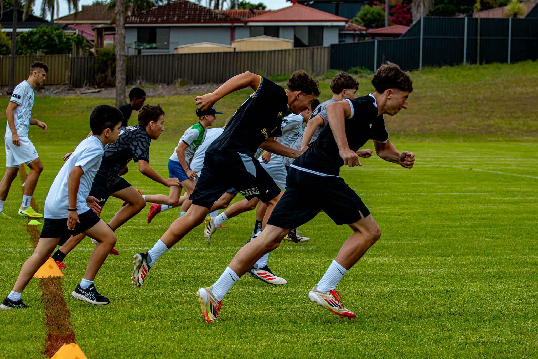 Gamechanger athletes running a sprint drill together at training.