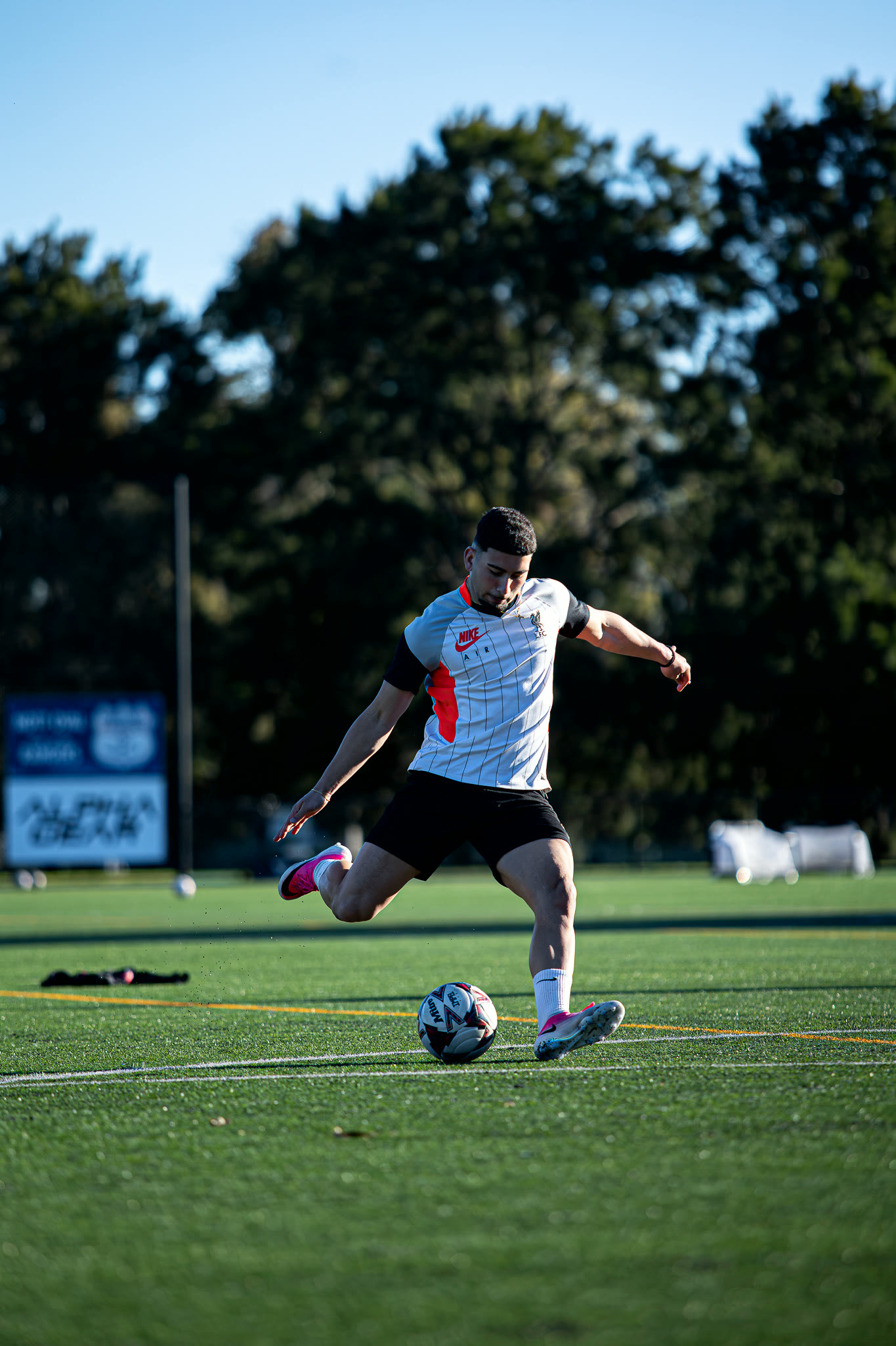 A player driving forward with the ball.